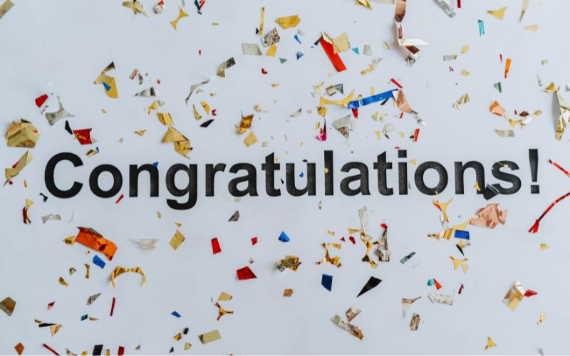 Congratulations with confetti background